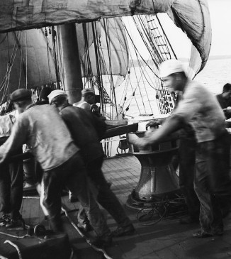 Crew at the capstan, weighing anchor